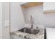 Modern laundry sink with granite countertop and stylish faucet at 3747 E Villa Cassandra Way, Cave Creek, AZ 85331