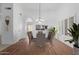 Bright dining room with wood floors and chandelier at 4554 W Whitten Ct, Chandler, AZ 85226