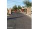 Gated entrance to the community with brick pillars and holiday wreaths at 7625 W Whitehorn Trl, Peoria, AZ 85383