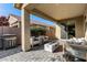 Outdoor patio with grill, fire pit and seating at 7625 W Whitehorn Trl, Peoria, AZ 85383