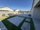 Backyard with paved patio and artificial turf at 7834 W Forest Grove Ave, Phoenix, AZ 85043