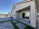 House back with patio, artificial grass, and sliding door at 7834 W Forest Grove Ave, Phoenix, AZ 85043