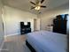 Spacious bedroom with ceiling fan and flat screen TV at 7834 W Forest Grove Ave, Phoenix, AZ 85043