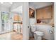 Main bathroom with toilet and granite countertops at 10327 N 99Th N St, Scottsdale, AZ 85258