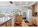 Modern kitchen with granite countertops and light wood cabinets at 10327 N 99Th N St, Scottsdale, AZ 85258