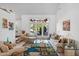 Bright living room with stained-glass window and comfortable seating at 10327 N 99Th N St, Scottsdale, AZ 85258