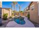 Freeform swimming pool with surrounding rocks at 10582 W Salter Dr, Peoria, AZ 85382