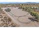 Aerial view of property with arena, stables, and desert landscape at 11942 N Vista Del Oro --, Fort McDowell, AZ 85264