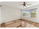 Bright bedroom with wood flooring and window coverings at 13026 W Foxfire Dr, Sun City West, AZ 85375