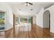 Bright living room with hardwood floors and sliding doors leading to the backyard at 13026 W Foxfire Dr, Sun City West, AZ 85375