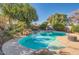 Inviting kidney-shaped pool with a spa and landscaping at 1335 W Manor St, Chandler, AZ 85224