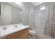 Clean bathroom with tub shower, vanity, and toilet at 15072 W Mckinley St, Goodyear, AZ 85338