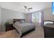 Bright bedroom with double bed and window coverings at 15072 W Mckinley St, Goodyear, AZ 85338