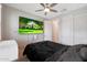Bedroom with large TV and ensuite bathroom access at 15072 W Mckinley St, Goodyear, AZ 85338