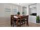 Charming dining room with wood table and bench seating at 15072 W Mckinley St, Goodyear, AZ 85338