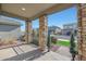 Front porch with stone columns and walkway at 15072 W Mckinley St, Goodyear, AZ 85338