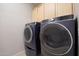 Laundry room with washer and dryer included at 15072 W Mckinley St, Goodyear, AZ 85338