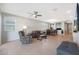 Bright and airy living room with tile floors and lots of natural light at 15072 W Mckinley St, Goodyear, AZ 85338