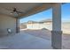 Covered patio with ceiling fan and backyard view at 15072 W Mckinley St, Goodyear, AZ 85338