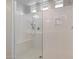 Walk-in shower with glass enclosure and built-in seat at 15072 W Mckinley St, Goodyear, AZ 85338