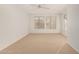 Spacious bedroom featuring neutral carpet and ceiling fan at 16319 W Mission Cove Ln, Surprise, AZ 85374