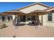 Large backyard patio with two umbrellas at 17915 W Silver Fox Way, Goodyear, AZ 85338