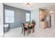 Bright dining area with kitchen access and tile flooring at 17915 W Silver Fox Way, Goodyear, AZ 85338