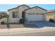 One-story home with two-car garage and desert landscaping at 17915 W Silver Fox Way, Goodyear, AZ 85338