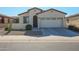 One-story home with two-car garage and desert landscaping at 17915 W Silver Fox Way, Goodyear, AZ 85338