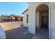 Front entry with arched walkway and decorative door at 17915 W Silver Fox Way, Goodyear, AZ 85338