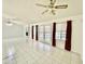 Spacious living room with tile floor and French doors leading to the backyard at 18024 N 36Th Ln, Glendale, AZ 85308