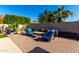 Spacious backyard with patio furniture and a putting green at 18174 W Wind Song Ave, Goodyear, AZ 85338