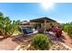 Relaxing backyard oasis with a pergola, pool, and patio furniture at 18174 W Wind Song Ave, Goodyear, AZ 85338