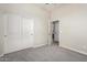 Bedroom with closet and access to bathroom at 18174 W Wind Song Ave, Goodyear, AZ 85338