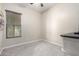 Bright bedroom with window, carpet, and ceiling fan at 18174 W Wind Song Ave, Goodyear, AZ 85338