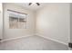 Spacious bedroom with window and carpet at 18174 W Wind Song Ave, Goodyear, AZ 85338