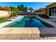 Stunning pool with spacious deck and tranquil water features at 18174 W Wind Song Ave, Goodyear, AZ 85338