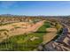 Aerial of community near golf course and lake at 24230 S Desert Vale Dr, Sun Lakes, AZ 85248