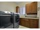 Laundry room with front load washer and dryer at 29228 N 70Th Way, Scottsdale, AZ 85266