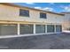 Exterior view of four-car garage with individual doors at 30 E Brown Rd # 2048, Mesa, AZ 85201