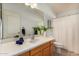 Clean bathroom with wood vanity and shower/tub combo at 3022 S Lobo Cyn, Mesa, AZ 85212