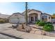 Charming single-story home with a welcoming front porch and well-maintained landscaping at 3022 S Lobo Cyn, Mesa, AZ 85212