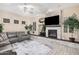 Relaxing living room with fireplace, built-in shelving, and hardwood floors at 3205 E Gemini Ct, Chandler, AZ 85249