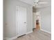 Bedroom with door to another room and wood-look flooring at 3330 E Main St # 111, Mesa, AZ 85213