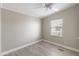 Simple bedroom with ceiling fan, window coverings and wood-look flooring at 3330 E Main St # 111, Mesa, AZ 85213