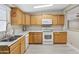 Bright kitchen featuring ample cabinetry, stainless steel sink, and modern appliances at 3330 E Main St # 111, Mesa, AZ 85213