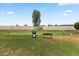 Community putting green with bench and trash receptacle at 3330 E Main St # 111, Mesa, AZ 85213