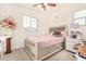 Bedroom with a queen-size bed and ample closet space at 3702 E Dogwood Dr, Chandler, AZ 85286