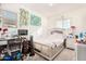 Bedroom with a queen bed, desk, and a large window at 3702 E Dogwood Dr, Chandler, AZ 85286