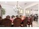 Dining room with a large table and chandelier at 3702 E Dogwood Dr, Chandler, AZ 85286